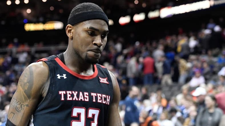 Texas Tech's guard De'Vion Harmon (23) walks off the court after the game against West Virginia in the first round of the Big 12 basketball tournament, Wednesday, March 8, 2023, at T-Mobile Center in Kansas City, Mo.