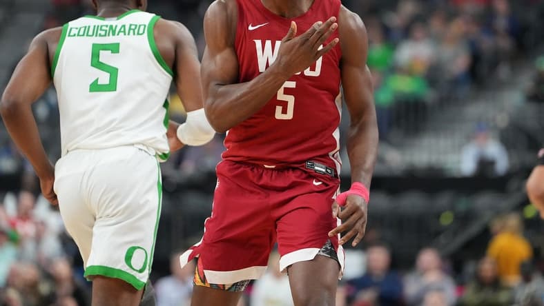 Mar 9, 2023; Las Vegas, NV, USA; Washington State Cougars guard TJ Bamba (5) reacts after a scoring play against the Oregon Ducks during the second half at T-Mobile Arena. Mandatory Credit: Stephen R. Sylvanie-USA TODAY Sports