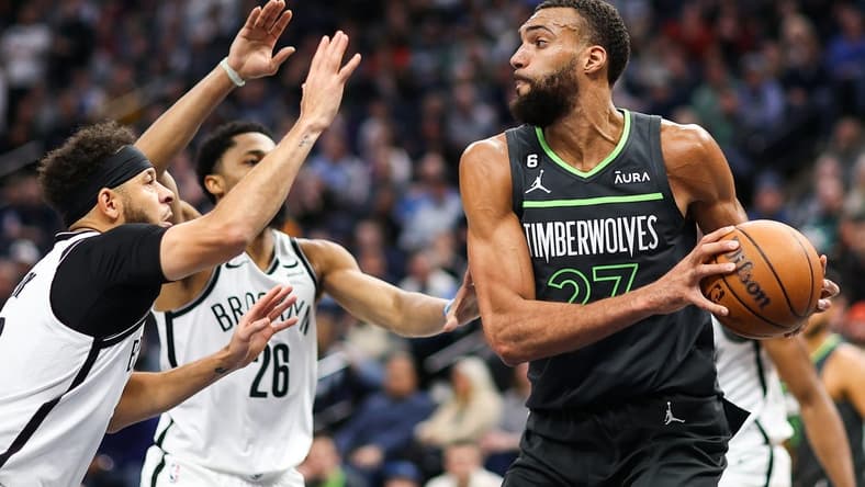 Mar 10, 2023; Minneapolis, Minnesota, USA; Minnesota Timberwolves center Rudy Gobert (27) looks to pass against the Brooklyn Nets during the fourth quarter at Target Center. Mandatory Credit: Matt Krohn-USA TODAY Sports