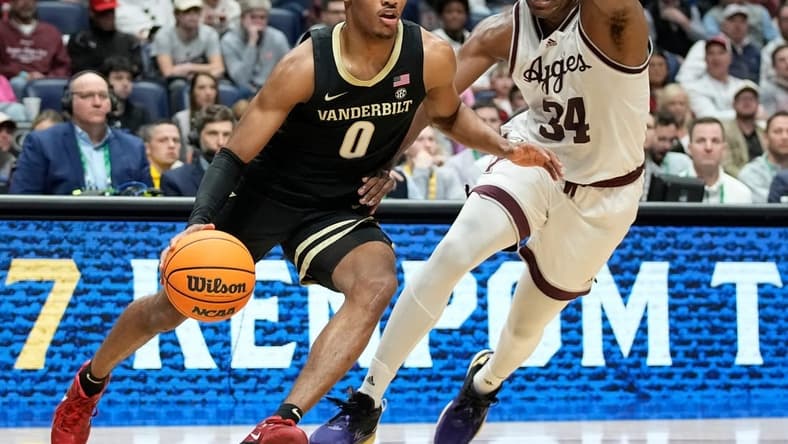 Vanderbilt guard Tyrin Lawrence (0) drives past Texas A&M forward Julius Marble (34) during the first half of a semifinal SEC Men   s Basketball Tournament game at Bridgestone Arena Saturday, March 11, 2023, in Nashville, Tenn.

Sec Basketball Vanderbilt Vs Texas A M