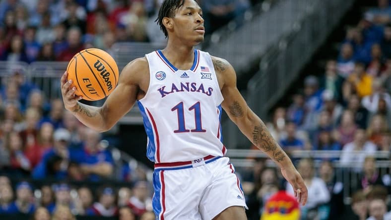 Mar 11, 2023; Kansas City, MO, USA; Kansas Jayhawks guard MJ Rice (11) sets the play during the first half against the Texas Longhornsat T-Mobile Center. Mandatory Credit: William Purnell-USA TODAY Sports