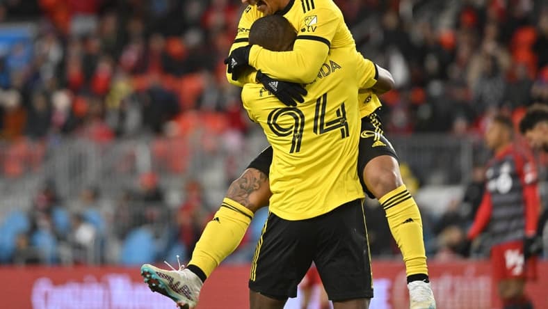 Mar 11, 2023; Toronto, Ontario, CAN; Columbus Crew forward Cucho Hernandez (9) celebrates with Columbus Crew midfielder Jimmy Medranda (94) after a goal against the Toronto FC in a MLS game at BMO Field. Mandatory Credit: Dan Hamilton-USA TODAY Sports