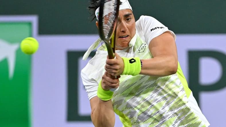 Mar 11, 2023; Indian Wells, CA, USA; Ons Jabeur (TUN) hits a shot during her second round match against Magdalena Frech (POL) in the BNP Paribas Open at the Indian Wells Tennis Garden. Mandatory Credit: Jayne Kamin-Oncea-USA TODAY Sports