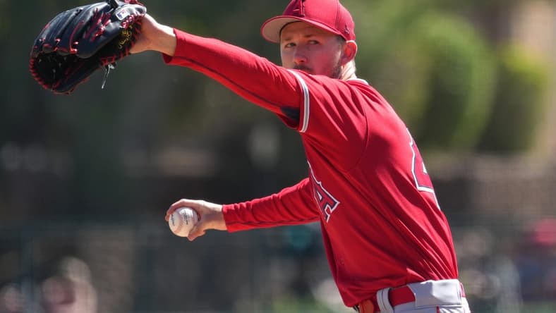 Mar 12, 2023; Phoenix, Arizona, USA; Los Angeles Angels starting pitcher Griffin Canning (47) pitches against the Chicago White Sox during the first inning at Camelback Ranch-Glendale. Mandatory Credit: Joe Camporeale-USA TODAY Sports
