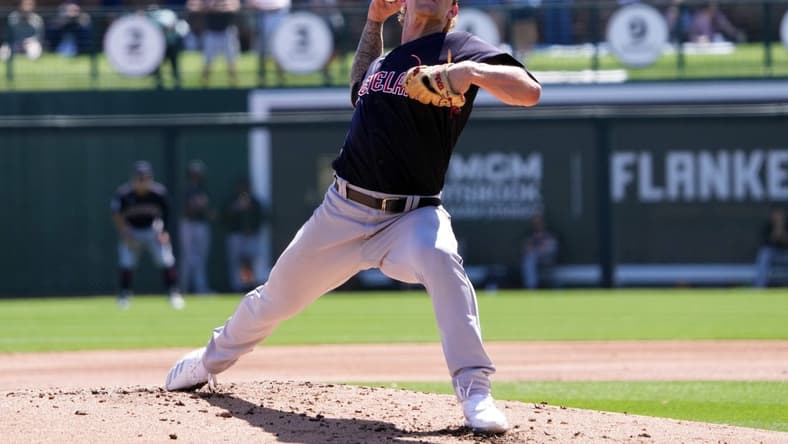 Mar 13, 2023; Phoenix, Arizona, USA; Cleveland Guardians starting pitcher Zach Plesac (34) pitches against the Los Angeles Dodgers during the first inning at Camelback Ranch-Glendale. Mandatory Credit: Joe Camporeale-USA TODAY Sports