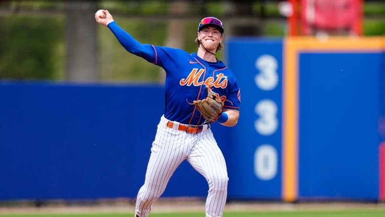 Mar 14, 2023; Port St. Lucie, Florida, USA; New York Mets third baseman Brett Baty (22) throws the ball to first against the Washington Nationals during the second inning at Clover Park. Mandatory Credit: Rich Storry-USA TODAY Sports