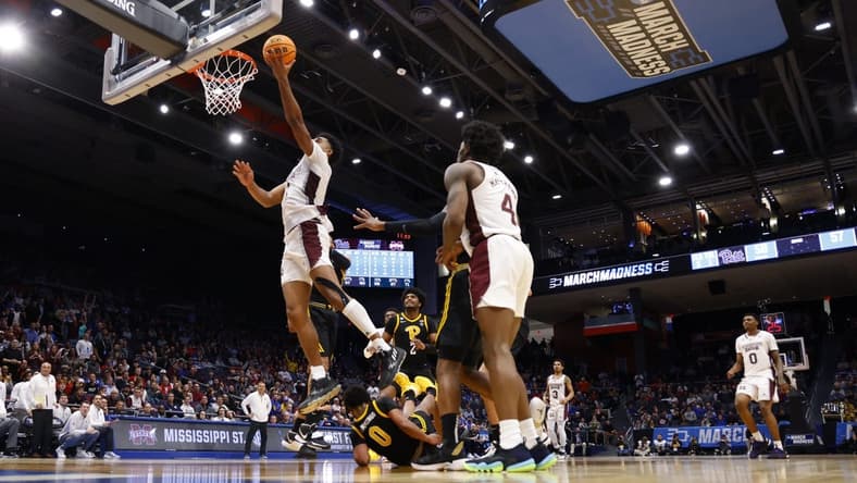 Mar 14, 2023; Dayton, OH, USA; Mississippi State Bulldogs forward Tolu Smith (1) goes to the basket over Pittsburgh Panthers guard Nelly Cummings (0) in the second half at UD Arena. Mandatory Credit: Rick Osentoski-USA TODAY Sports