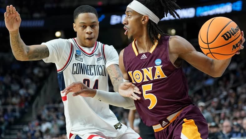 Mar 17, 2023; Albany, NY, USA; Iona Gaels guard Daniss Jenkins (5) dribbles the ball against UConn Huskies guard Jordan Hawkins (24) during the first half at MVP Arena. Mandatory Credit: David Butler II-USA TODAY Sports