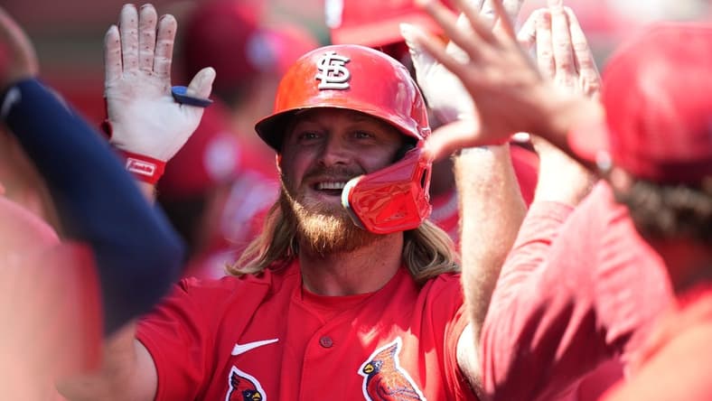 Mar 18, 2023; Jupiter, Florida, USA;  St. Louis Cardinals third baseman Taylor Motter (55) is congratulated by teammates after hitting a home run in the second inning against the Detroit Tigers at Roger Dean Stadium. Mandatory Credit: Jim Rassol-USA TODAY Sports