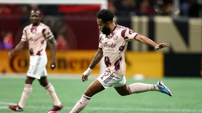 Mar 18, 2023; Atlanta, Georgia, USA; Portland Timbers midfielder Eryk Williamson (19) kicks the ball during the second half against the Atlanta United at Mercedes-Benz Stadium. Mandatory Credit: Brett Davis-USA TODAY Sports