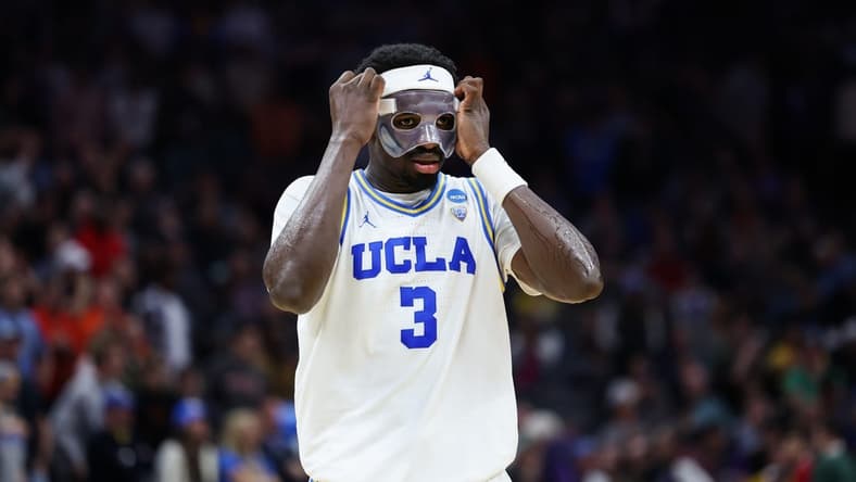 Mar 18, 2023; Sacramento, CA, USA; UCLA Bruins forward Adem Bona (3) adjusts his protective mask during the second half against the Northwestern Wildcats at Golden 1 Center. Mandatory Credit: Kelley L Cox-USA TODAY Sports