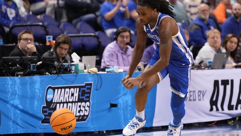 Mar 19, 2023; Greensboro, NC, USA; Kentucky Wildcats guard Antonio Reeves (12) goes for a loose ball during the second half against the Kansas State Wildcats in the second round of the 2023 NCAA men s basketball tournament at Greensboro Coliseum. Mandatory Credit: Bob Donnan-USA TODAY Sports
