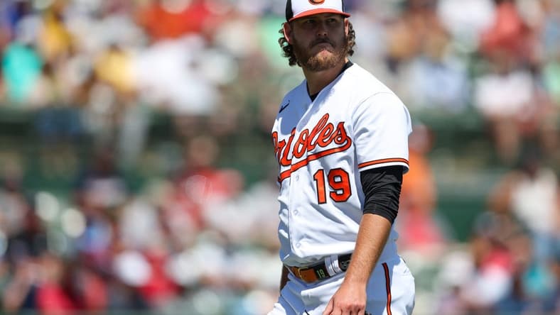 Mar 21, 2023; Sarasota, Florida, USA;  Baltimore Orioles starting pitcher Cole Irvin (19) walks off the field against the Boston Red Sox in the sixth inning during spring training at Ed Smith Stadium. Mandatory Credit: Nathan Ray Seebeck-USA TODAY Sports