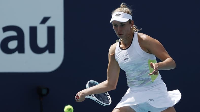 Mar 23, 2023; Miami, Florida, US; Elise Mertens (BEL) hits a forehand against Daria Kasatkina (not pictured) on day four of the Miami Open at Hard Rock Stadium. Mandatory Credit: Geoff Burke-USA TODAY Sports