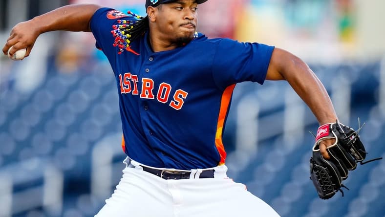Mar 23, 2023; West Palm Beach, Florida, USA; Houston Astros starting pitcher Luis Garcia (77) throws a pitch against the Washington Nationals during the first inning at The Ballpark of the Palm Beaches. Mandatory Credit: Rich Storry-USA TODAY Sports