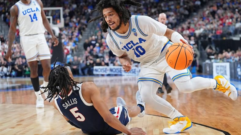 Mar 23, 2023; Las Vegas, NV, USA; UCLA Bruins guard Tyger Campbell (10) drives to the basket against Gonzaga Bulldogs guard Hunter Sallis (5) during the second half at T-Mobile Arena. Mandatory Credit: Joe Camporeale-USA TODAY Sports