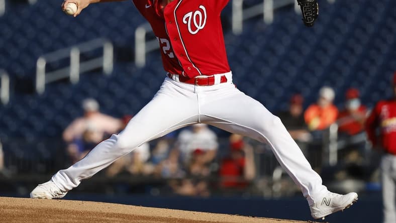 Mar 24, 2023; West Palm Beach, Florida, USA; Washington Nationals starting pitcher Chad Kuhl (52) pitches against the St. Louis Cardinals during the first inning at The Ballpark of the Palm Beaches. Mandatory Credit: Rhona Wise-USA TODAY Sports