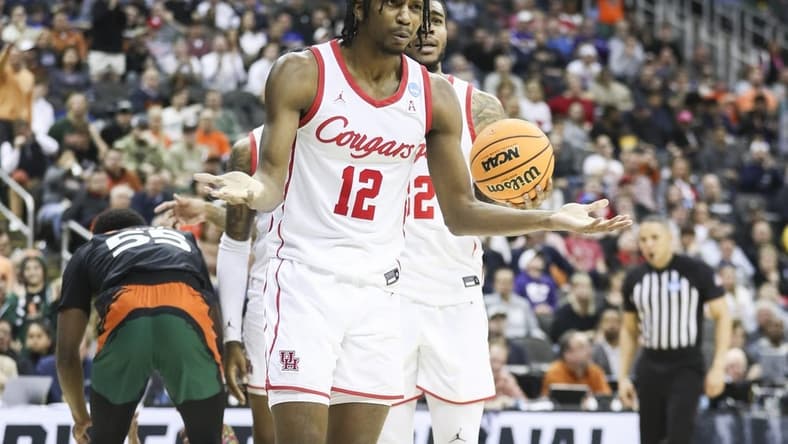 Mar 24, 2023; Kansas City, MO, USA; Houston Cougars guard Tramon Mark (12) reacts after a foul call during the second half of an NCAA tournament Midwest Regional semifinal against the Miami Hurricanes at T-Mobile Center. Mandatory Credit: William Purnell-USA TODAY Sports