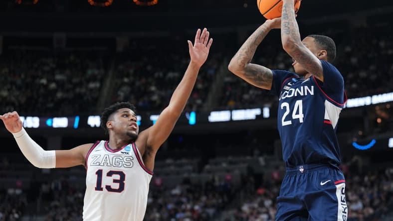 Mar 25, 2023; Las Vegas, NV, USA; Connecticut Huskies guard Jordan Hawkins (24) shoots the ball over Gonzaga Bulldogs guard Malachi Smith (13) during the second half for the NCAA tournament West Regional final at T-Mobile Arena. Mandatory Credit: Joe Camporeale-USA TODAY Sports