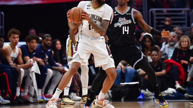 Mar 25, 2023; Los Angeles, California, USA; New Orleans Pelicans forward Brandon Ingram (14) controls the ball against Los Angeles Clippers guard Terance Mann (14) during the second half at Crypto.com Arena. Mandatory Credit: Gary A. Vasquez-USA TODAY Sports