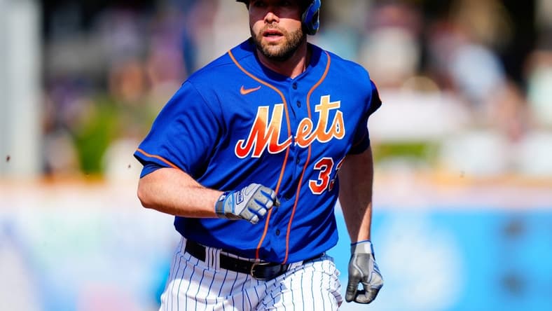 Mar 26, 2023; Port St. Lucie, Florida, USA; New York Mets first baseman Darin Ruf (33) runs into third base against the Miami Marlins during the second inning at Clover Park. Mandatory Credit: Rich Storry-USA TODAY Sports