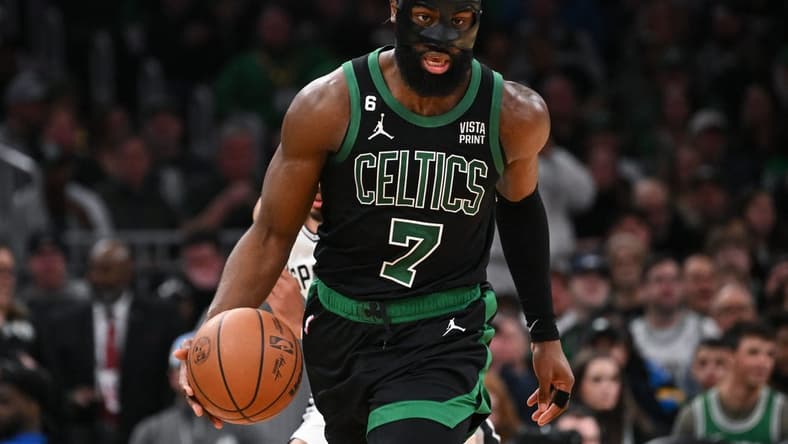 Mar 26, 2023; Boston, Massachusetts, USA; Boston Celtics guard Jaylen Brown (7) dribbles the ball against the San Antonio Spurs during the third quarter at the TD Garden. Mandatory Credit: Brian Fluharty-USA TODAY Sports