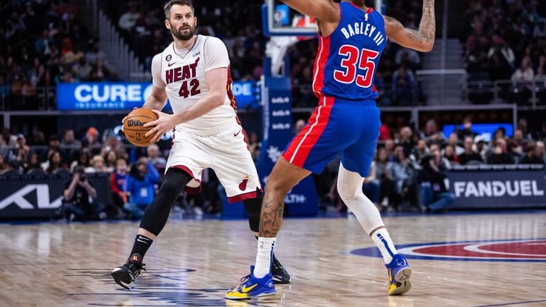 Mar 19, 2023; Detroit, Michigan, USA; Miami Heat forward Kevin Love (42) against Detroit Pistons forward Marvin Bagley III (35) in the second quarter at Little Caesars Arena. Mandatory Credit: Allison Farrand-USA TODAY Sports