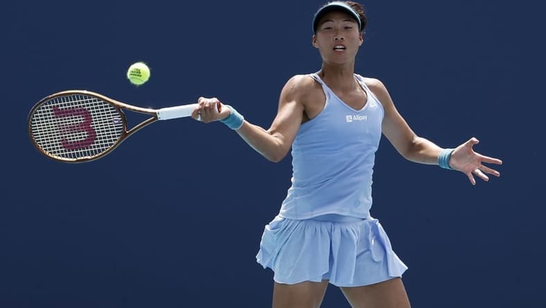 Mar 27, 2023; Miami, Florida, US; Qinwen Zheng (CHN) serves against Anastasia Potapova (not pictured) on day eight of the Miami Open at Hard Rock Stadium. Mandatory Credit: Geoff Burke-USA TODAY Sports