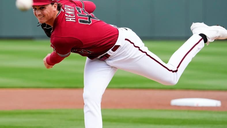 Arizona Diamondbacks starting pitcher Tommy Henry (47) makes his warm-up throws before facing the San Francisco Giants in the first inning during a spring training game at Salt River Fields in Scottsdale on March 14, 2023.

Mlb Giants At Diamondbacks