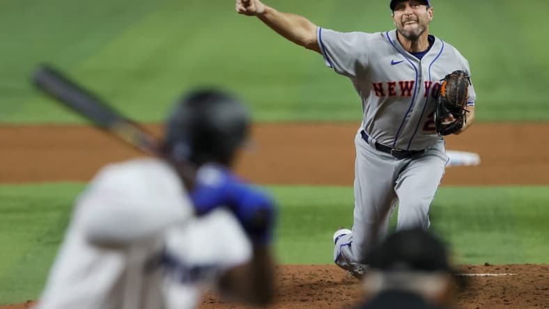 Mar 30, 2023; Miami, Florida, USA; New York Mets starting pitcher Max Scherzer (21) delivers a pitch during the fifth inning against the Miami Marlins at loanDepot Park. Mandatory Credit: Sam Navarro-USA TODAY Sports