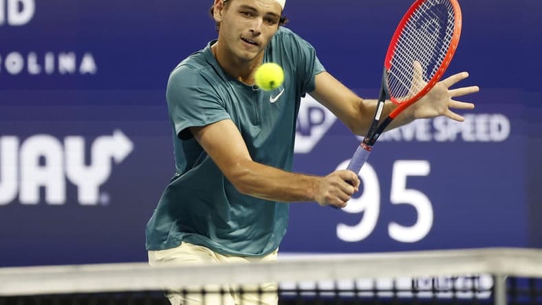 Mar 30, 2023; Miami, Florida, US; Taylor Fritz (USA) hits a volley against Carlos Alcaraz (ESP) (not pictured) in a men's singles quarterfinal on day eleven of the Miami Open at Hard Rock Stadium. Mandatory Credit: Geoff Burke-USA TODAY Sports