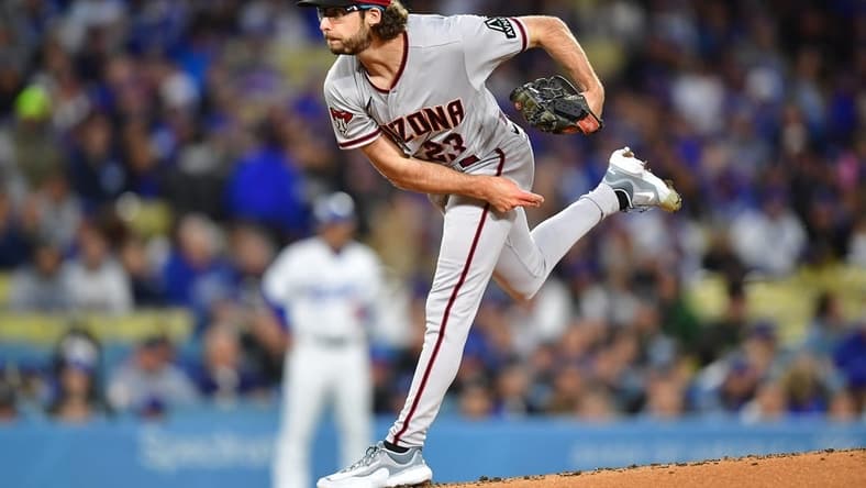 Mar 30, 2023; Los Angeles, California, USA; Arizona Diamondbacks starting pitcher Zac Gallen (23) throws against the Los Angeles Dodgers during the first inning at Dodger Stadium. Mandatory Credit: Gary A. Vasquez-USA TODAY Sports