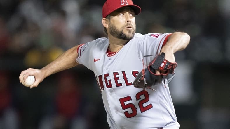 March 30, 2023; Oakland, California, USA; Los Angeles Angels relief pitcher Ryan Tepera (52) delivers a pitch against the Oakland Athletics during the eighth inning at RingCentral Coliseum. Mandatory Credit: Kyle Terada-USA TODAY Sports
