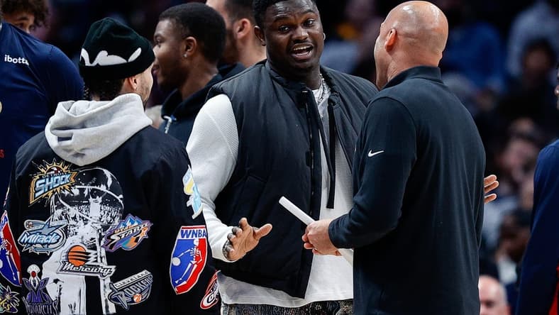 Mar 30, 2023; Denver, Colorado, USA; New Orleans Pelicans forward Zion Williamson (C) talks with guard Jose Alvarado (L) and assistant coach Fred Vinson (R) in the second quarter against the Denver Nuggets at Ball Arena. Mandatory Credit: Isaiah J. Downing-USA TODAY Sports