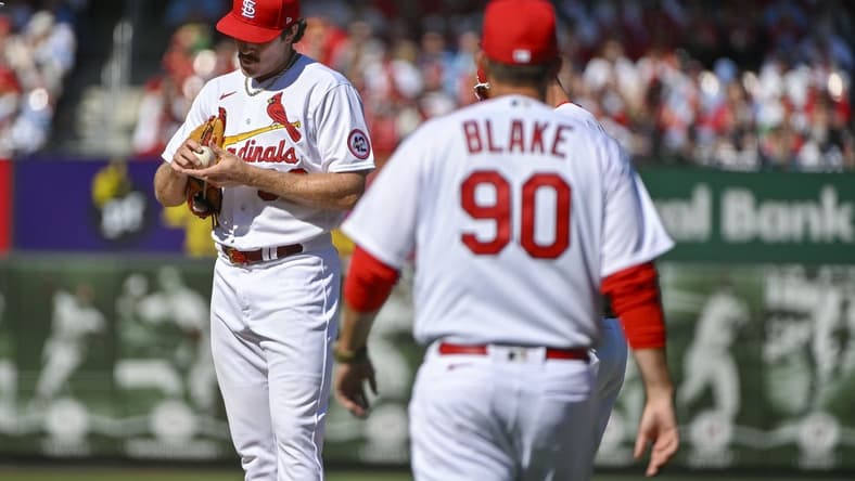 Mar 30, 2023; St. Louis, Missouri, USA;  St. Louis Cardinals starting pitcher Miles Mikolas (39) stands on the mound as pitching coach Dusty Blake (90) walks out during the first inning against the Toronto Blue Jays at Busch Stadium. Mandatory Credit: Jeff Curry-USA TODAY Sports