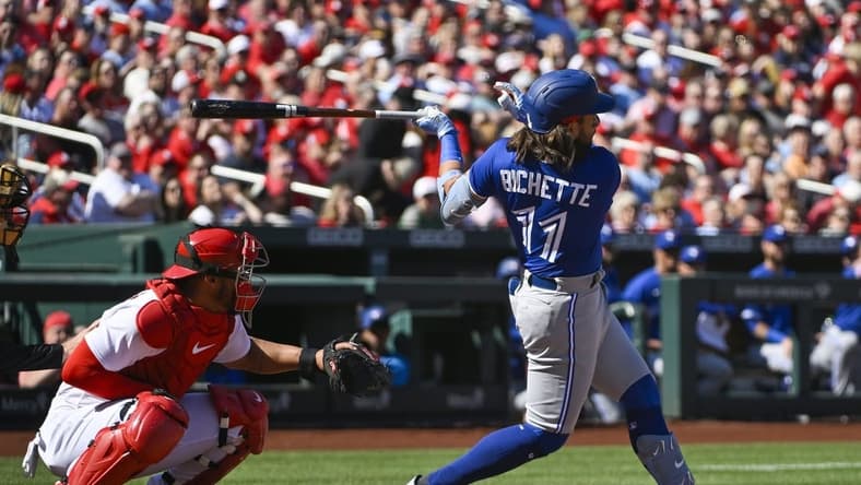 Mar 30, 2023; St. Louis, Missouri, USA;  Toronto Blue Jays shortstop Bo Bichette (11) hits a single against the St. Louis Cardinals during the first inning at Busch Stadium. Mandatory Credit: Jeff Curry-USA TODAY Sports