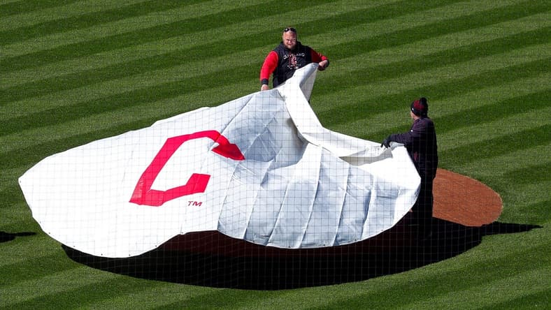Members of the Cleveland Guardians grounds crew pulls the tarp over the mound at Progressive Field, Thursday, March 30, 2023, in Cleveland, Ohio.

Guardians Preview 6