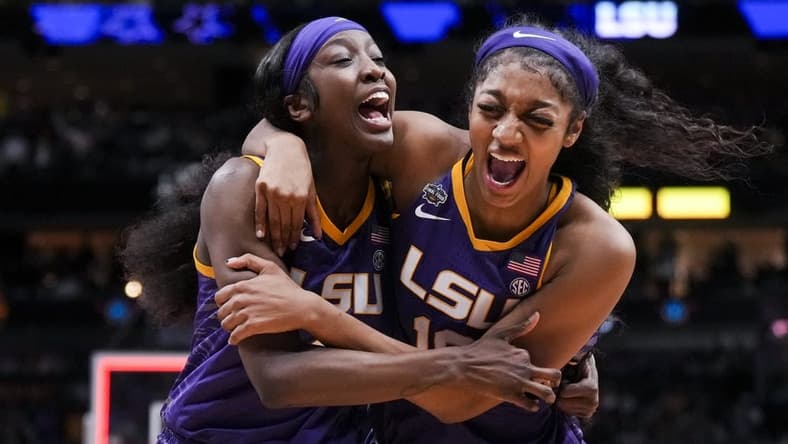 Mar 31, 2023; Dallas, TX, USA; LSU Lady Tigers guard Flau'jae Johnson, left, celebrates with forward Angel Reese after defeating the Virginia Tech Hokies in semifinals of the women's Final Four of the 2023 NCAA Tournament at American Airlines Center. Mandatory Credit: Kirby Lee-USA TODAY Sports