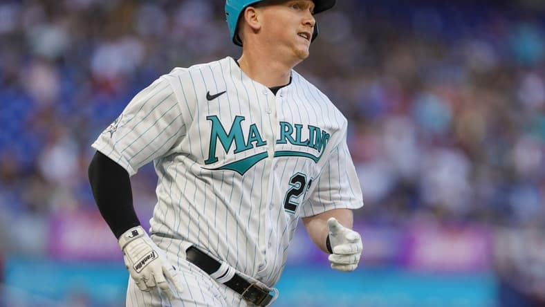 Mar 31, 2023; Miami, Florida, USA; Miami Marlins designated hitter Garrett Cooper (26) runs toward third base after hitting a triple during the first inning against the New York Mets at loanDepot Park. Mandatory Credit: Sam Navarro-USA TODAY Sports