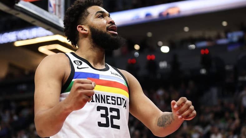 Mar 31, 2023; Minneapolis, Minnesota, USA; Minnesota Timberwolves center Karl-Anthony Towns (32) reacts to his shot against the Los Angeles Lakers during the third quarter at Target Center. Mandatory Credit: Matt Krohn-USA TODAY Sports