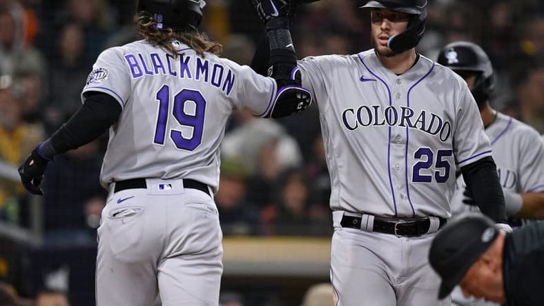Mar 31, 2023; San Diego, California, USA; Colorado Rockies designated hitter Charlie Blackmon (19) is congratulated by first baseman C.J. Cron (25) after hitting a two-run home run during the fifth inning against the San Diego Padresat Petco Park. Mandatory Credit: Orlando Ramirez-USA TODAY Sports
