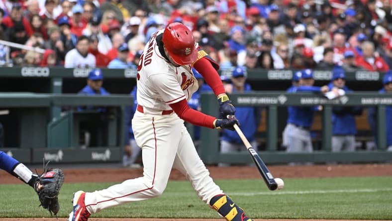 Apr 1, 2023; St. Louis, Missouri, USA; St. Louis Cardinals third baseman Nolan Arenado (28) hits an RBI double against the Toronto Blue Jays in the third inning at Busch Stadium. Mandatory Credit: Joe Puetz-USA TODAY Sports