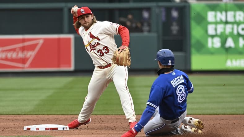 Apr 1, 2023; St. Louis, Missouri, USA; Toronto Blue Jays second baseman Cavan Biggio (8) is out at second as St. Louis Cardinals second baseman Brendan Donovan (33) turns a double play in the second inning at Busch Stadium. Mandatory Credit: Joe Puetz-USA TODAY Sports