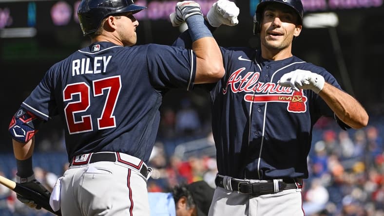Apr 1, 2023; Washington, District of Columbia, USA; Atlanta Braves first baseman Matt Olson (28) celebrates with third baseman Austin Riley (27) after hitting a solo home run against the Washington Nationals during the first inning at Nationals Park. Mandatory Credit: Brad Mills-USA TODAY Sports