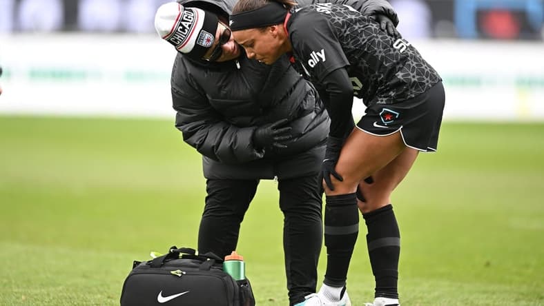 Apr 1, 2023; Bridgeview, Illinois, USA; Chicago Red Stars forward Mallory Swanson (9) receives medical treatment after an injury at SeatGeek Stadium. Mandatory Credit: Daniel Bartel-USA TODAY Sports