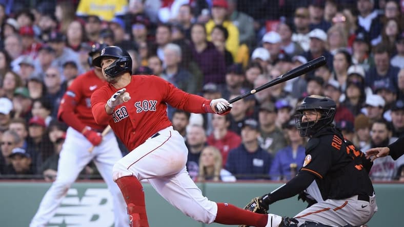 Apr 1, 2023; Boston, Massachusetts, USA; Boston Red Sox center fielder Adam Duvall (18) hits a two-run home run during the third inning against the Baltimore Orioles at Fenway Park. Mandatory Credit: Bob DeChiara-USA TODAY Sports