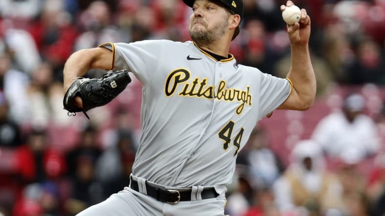 Apr 1, 2023; Cincinnati, Ohio, USA; Pittsburgh Pirates starting pitcher Rich Hill (44) throws against the Cincinnati Reds during the first inning at Great American Ball Park. Mandatory Credit: David Kohl-USA TODAY Sports