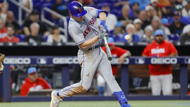 Apr 1, 2023; Miami, Florida, USA; New York Mets left fielder Mark Canha (19) hits an RBI single during the fifth inning against the Miami Marlins at loanDepot Park. Mandatory Credit: Sam Navarro-USA TODAY Sports