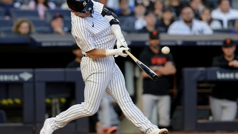 Apr 1, 2023; Bronx, New York, USA; New York Yankees third baseman Josh Donaldson (28) hits a solo home run against the San Francisco Giants during the eighth inning at Yankee Stadium. Mandatory Credit: Brad Penner-USA TODAY Sports