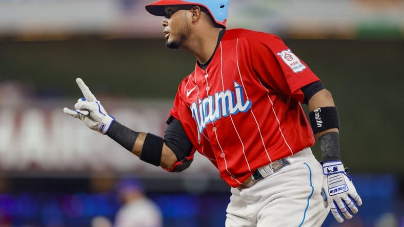 Apr 1, 2023; Miami, Florida, USA; Miami Marlins second baseman Luis Arraez (3) reacts from first base after a base hit during the second inning against the New York Mets at loanDepot Park. Mandatory Credit: Sam Navarro-USA TODAY Sports